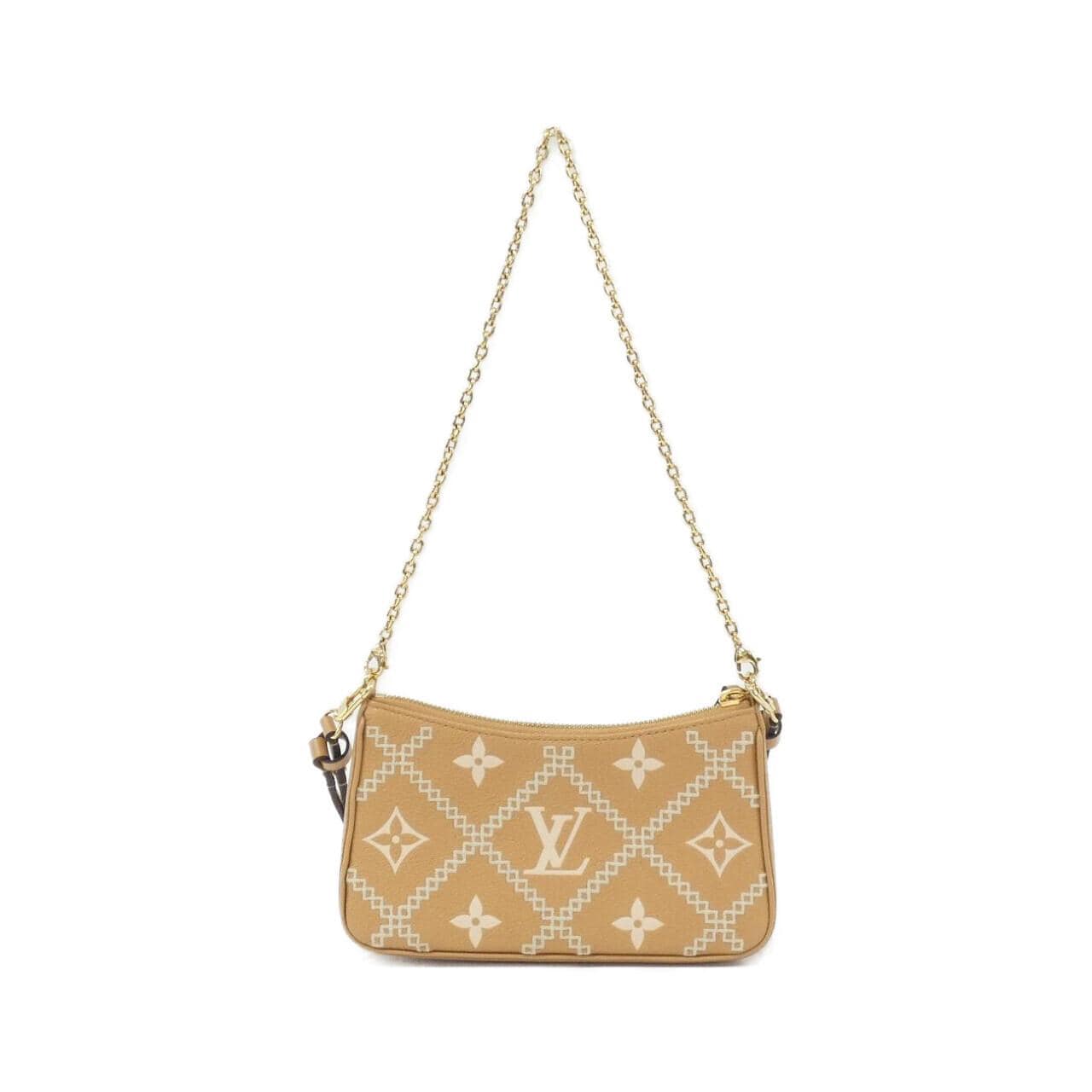 Louis_Vuitton_Monogram_Empreinte_Broderie_Mini_Pochette_Accessoires_M81137_Bag_2